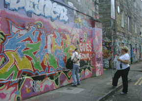 graffitiwall_wideshot On the way to the show, we stopped at Windmill Lane-home of the studio U2 used during the 80's, and where fans from all over the world stop to leave well wishes graffiti'd on the wall. Since the show is this weekend, there are a ton of brand new messages.