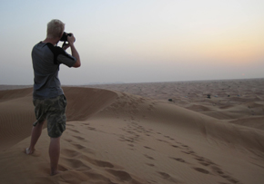 e_takingpicture The trip continued with an authentic bedoin dinner, camel rides, and belly dancing. I would definatly recommend this adventure to anyone who will be in Dubai who has a love for adventure and doesn't mind getting thrown around a bit. If you don't like rollercoasters then this is not something you want to try. It reminds me of a rollercoaster without a track and the driver does a great job of pulling unexpected dives and turns throughout the dune. For anyone seeking a heart pounding journey It's great adventure not to be missed!